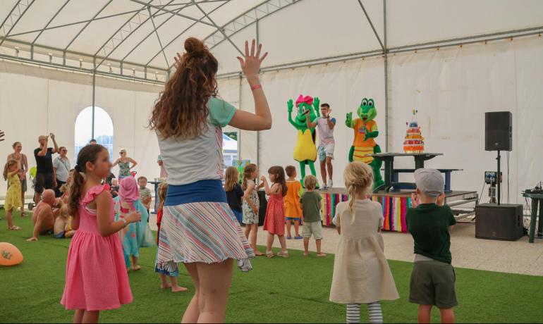 Children's party with entertainers and crocodile costumes.